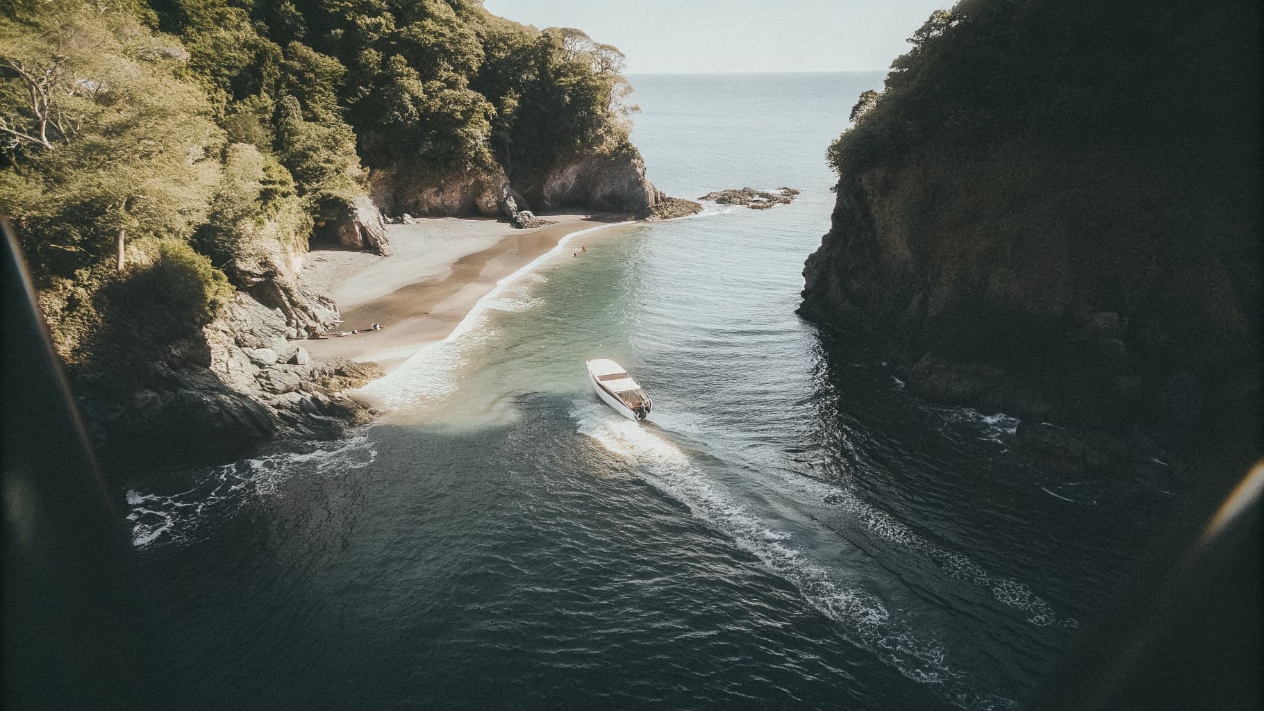 Sportfishing boat running along the coastline near Quepos, Costa Rica